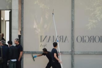 crowds gather outside giorgio armanis milan hq to pay respects before funeral 68bb1593e5a85